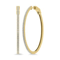 Gold hoop earrings with embedded diamonds on a white background