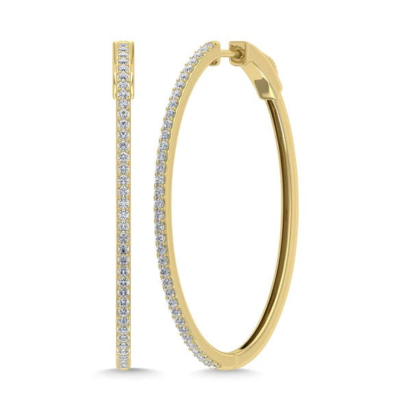 Gold hoop earrings with embedded diamonds on a white background