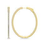 Gold hoop earrings with embedded stones on a white background