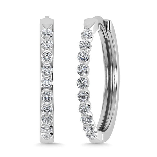 Pair of diamond hoop earrings on a white background
