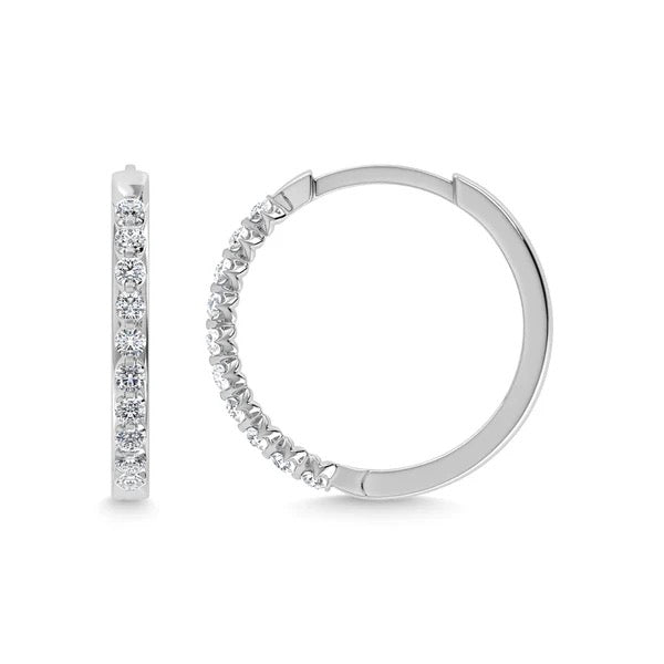Silver hoop earrings with clear gemstones on a white background