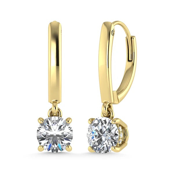 Gold earrings with round gemstones on a white background