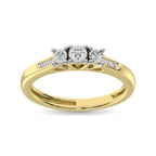 Gold ring with three diamonds on a white background