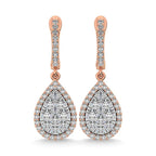 Rose gold teardrop earrings with diamond accents on a white background